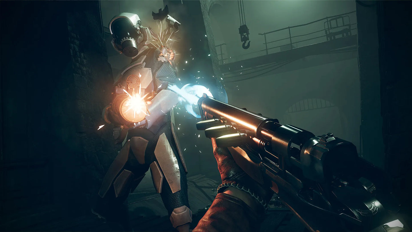 Close-up of a futuristic weapon held by a hand, with a character in a suit in the background.