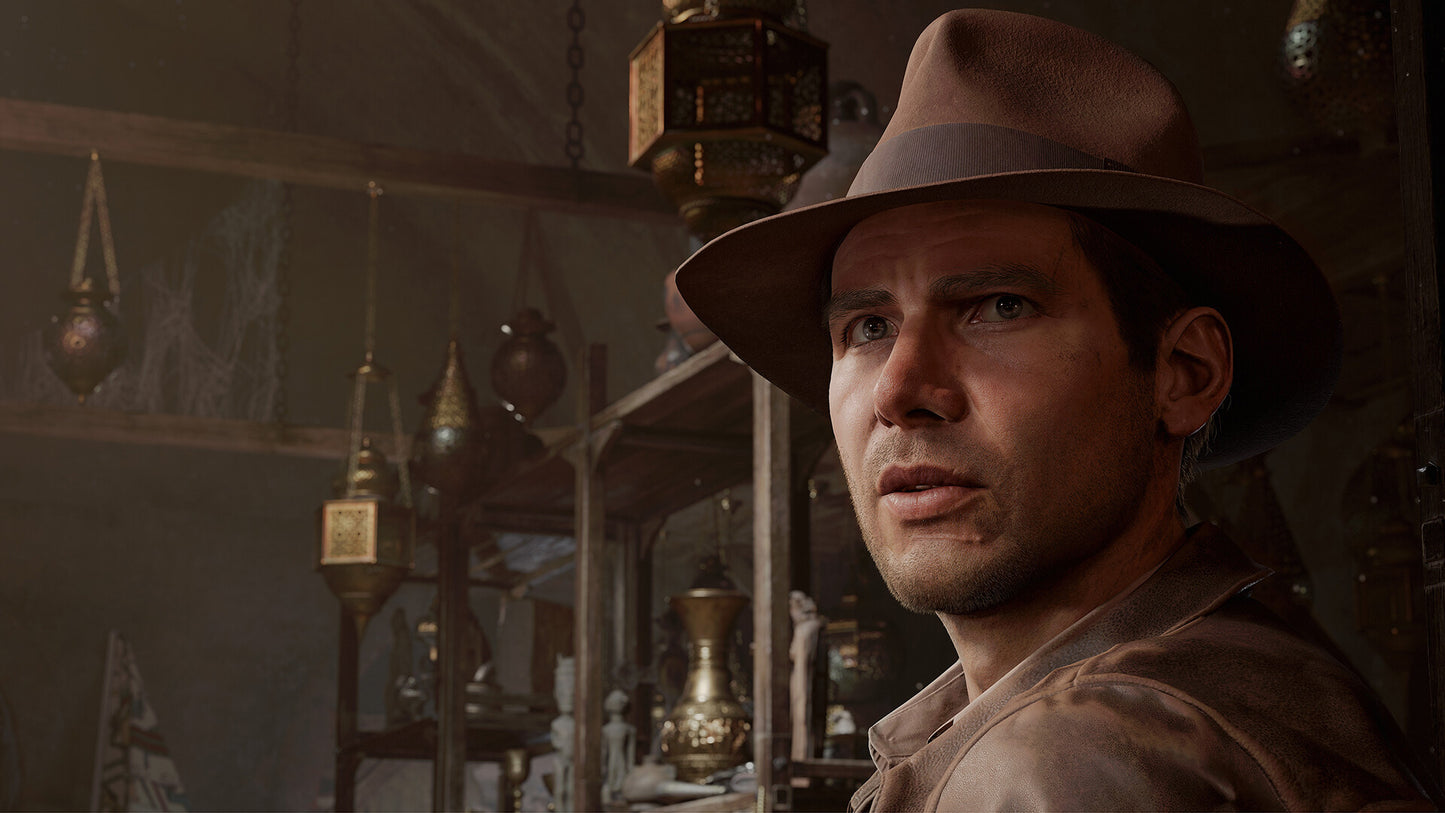 Man wearing a hat in a dimly lit room with hanging lanterns
