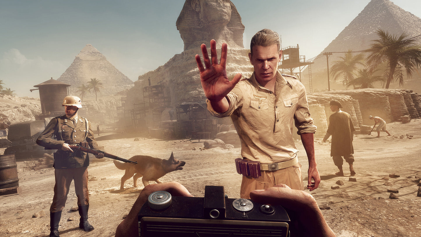 Man in a desert setting with pyramids and soldiers in the background