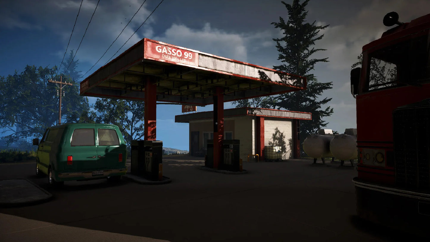 Gas station with a green car and red truck under a dark sky