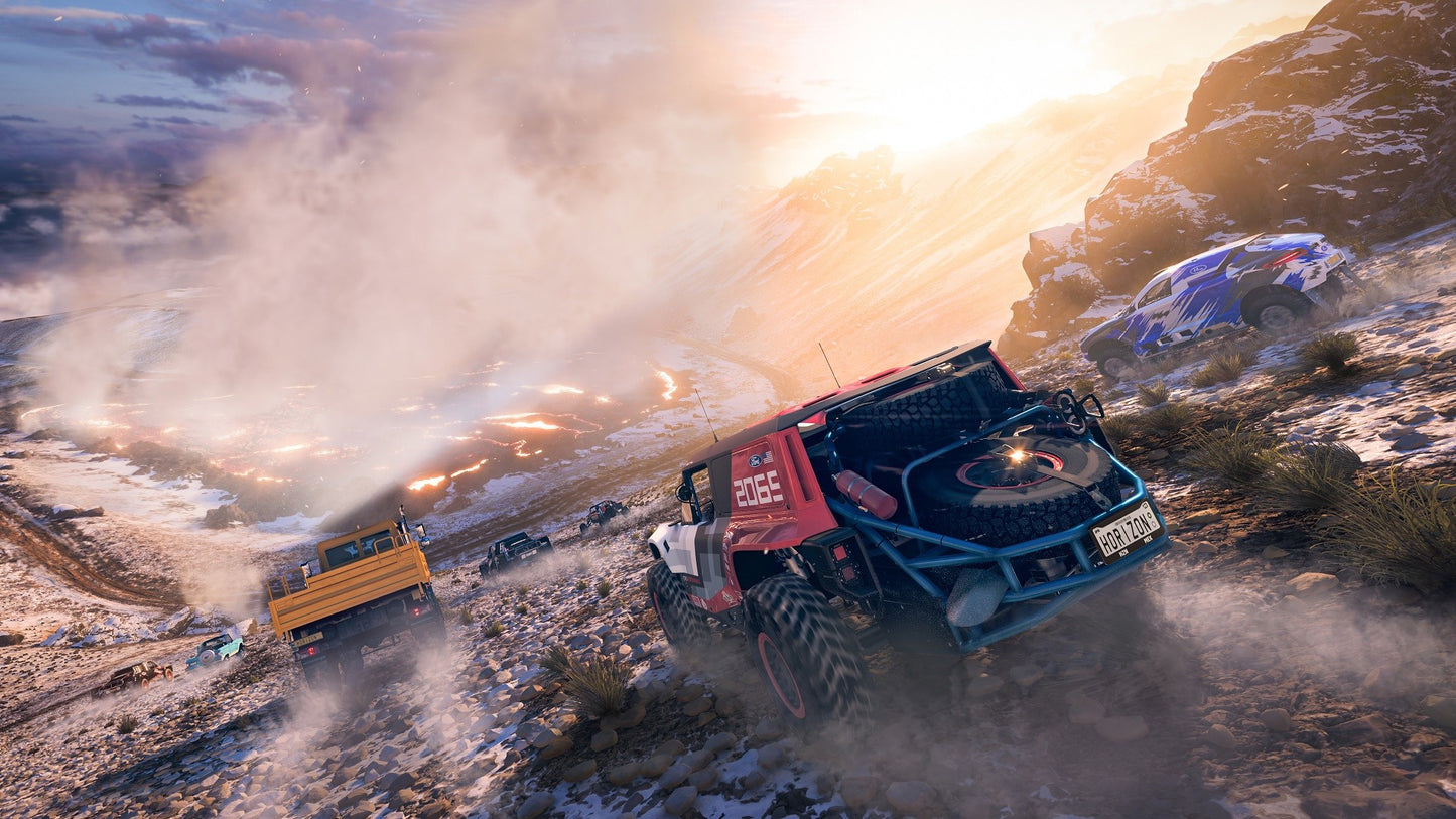 Off-road vehicle driving through a desert landscape with mountains in the background