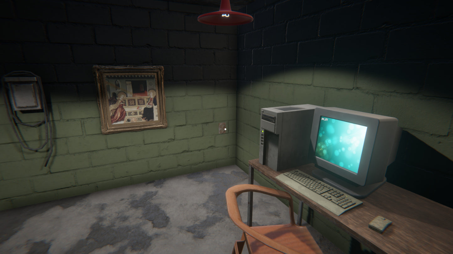 Vintage computer setup in a dimly lit room with a framed picture on the wall.