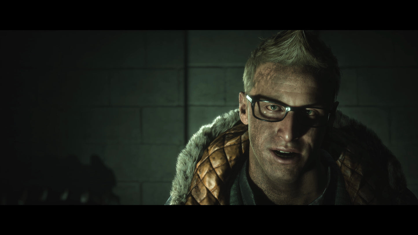 Person wearing glasses and a fur-lined coat in a dimly lit room