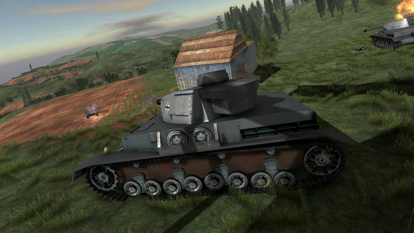 Tank in a grassy field with a barn and another tank in the background