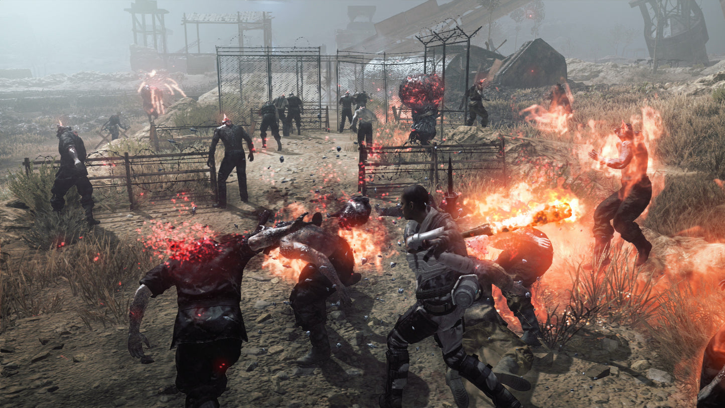 Group of people in a post-apocalyptic setting with fires and debris.