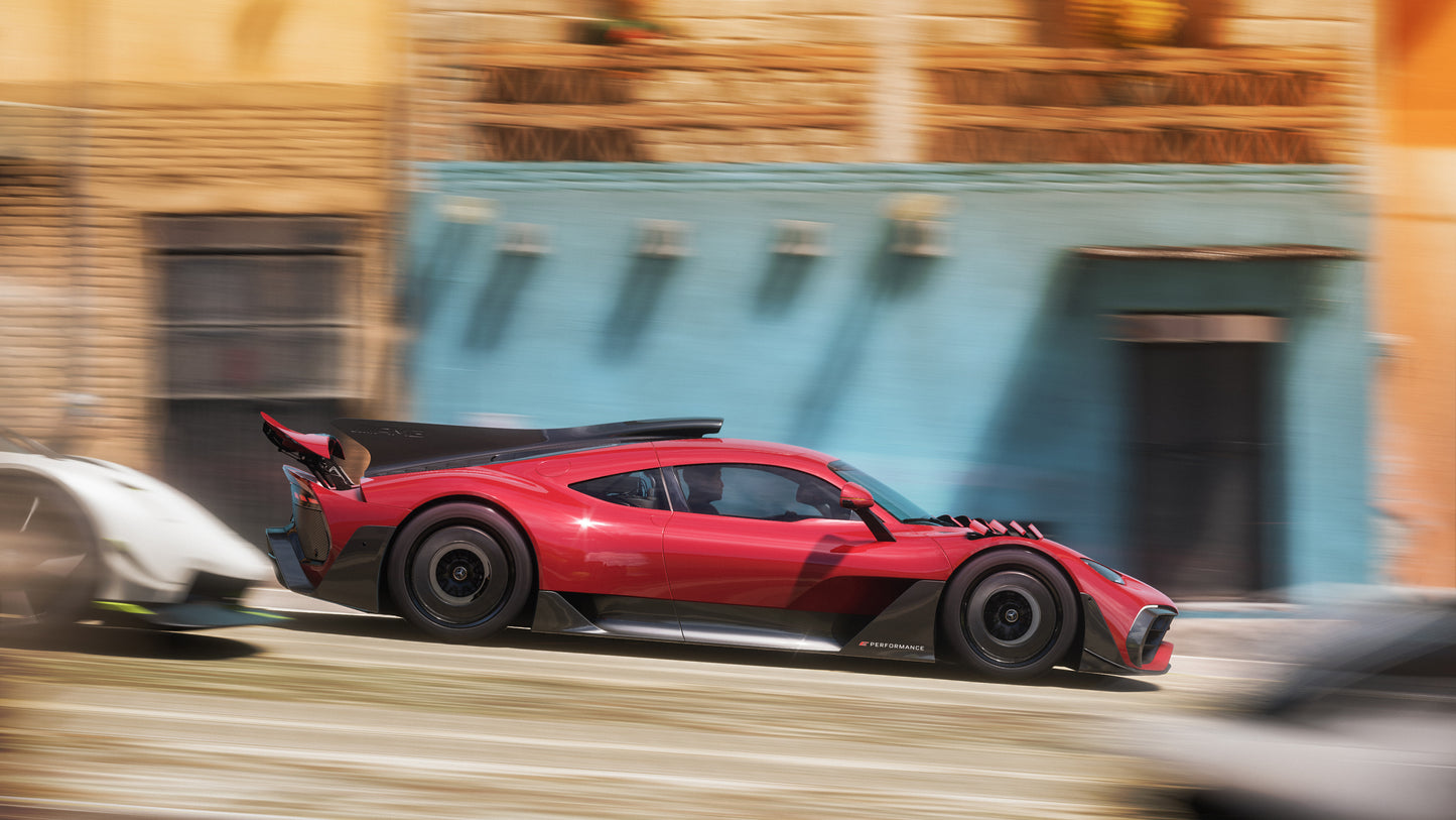 Red sports car racing on a blurred street background