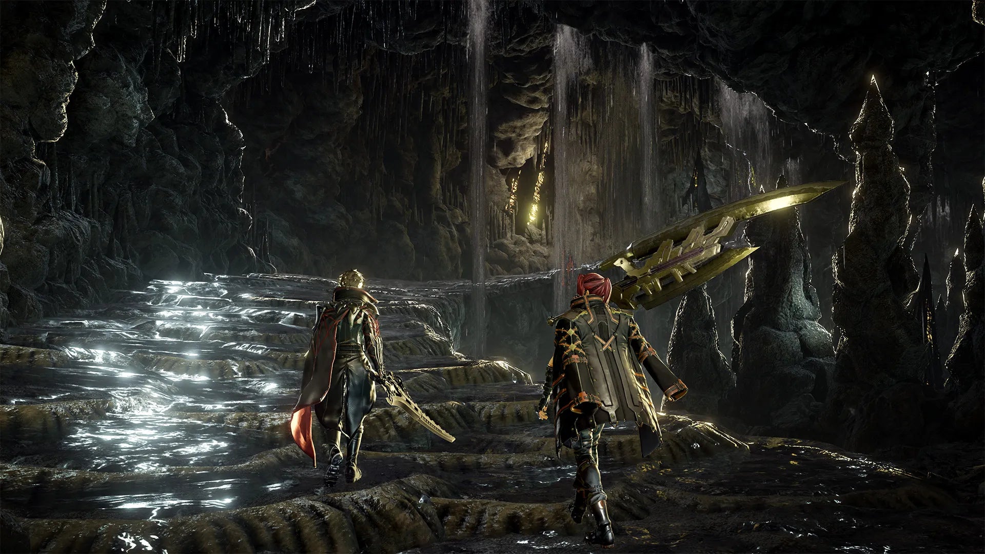 Two characters in a dark, cave-like environment with a glowing sword.