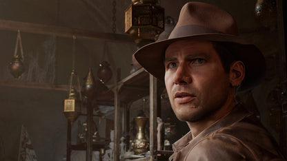 Man wearing a hat in a dimly lit room with hanging lanterns