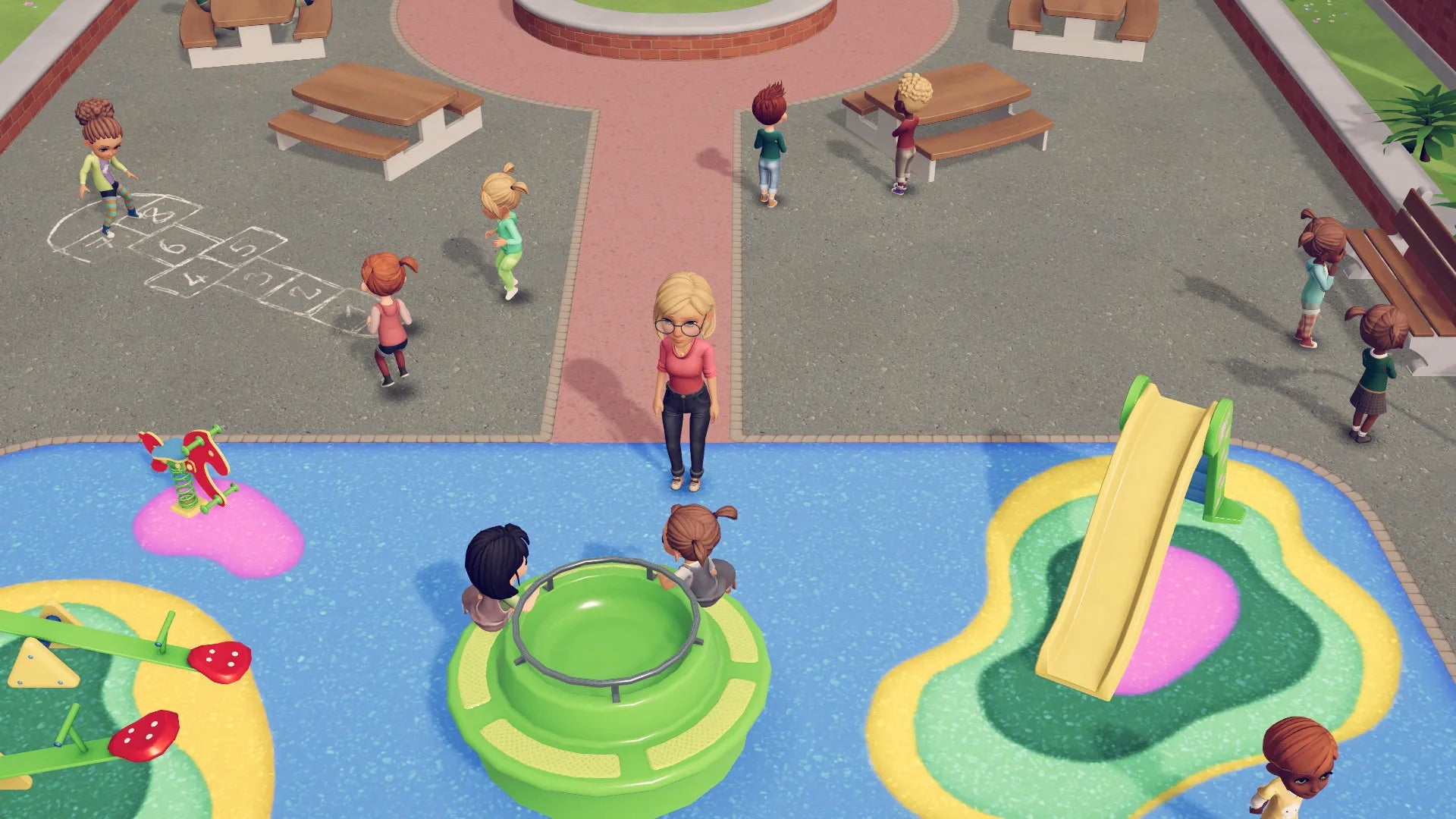 Children playing on a playground with colorful equipment and benches.