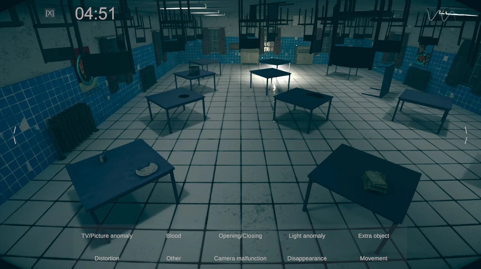 Darkly lit room with tables and benches, possibly a waiting area or lounge.