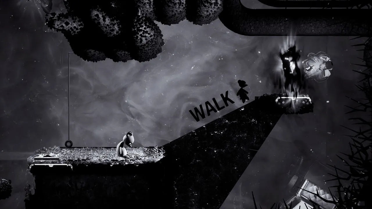 Black and white scene with a person sitting on a ledge, looking at a path labeled 'WALK'.