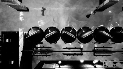 Black and white image of a mechanical setup with large cylindrical objects and pipes.