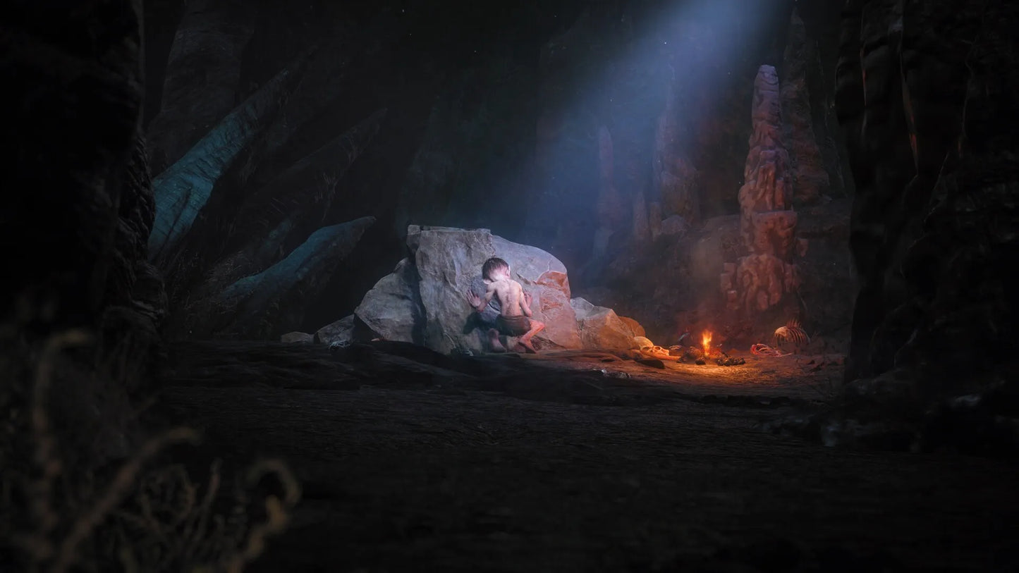 Dark cave scene with a person sitting on a rock, illuminated by a torch.