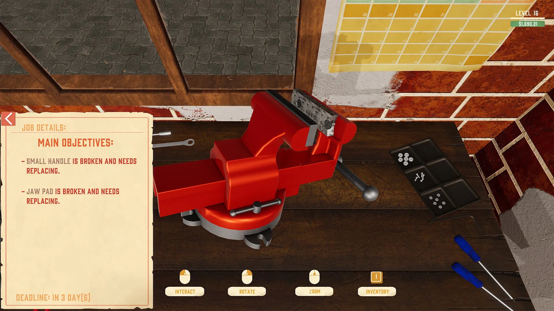 Red vise on a workbench with tools and a repair interface on a computer screen.