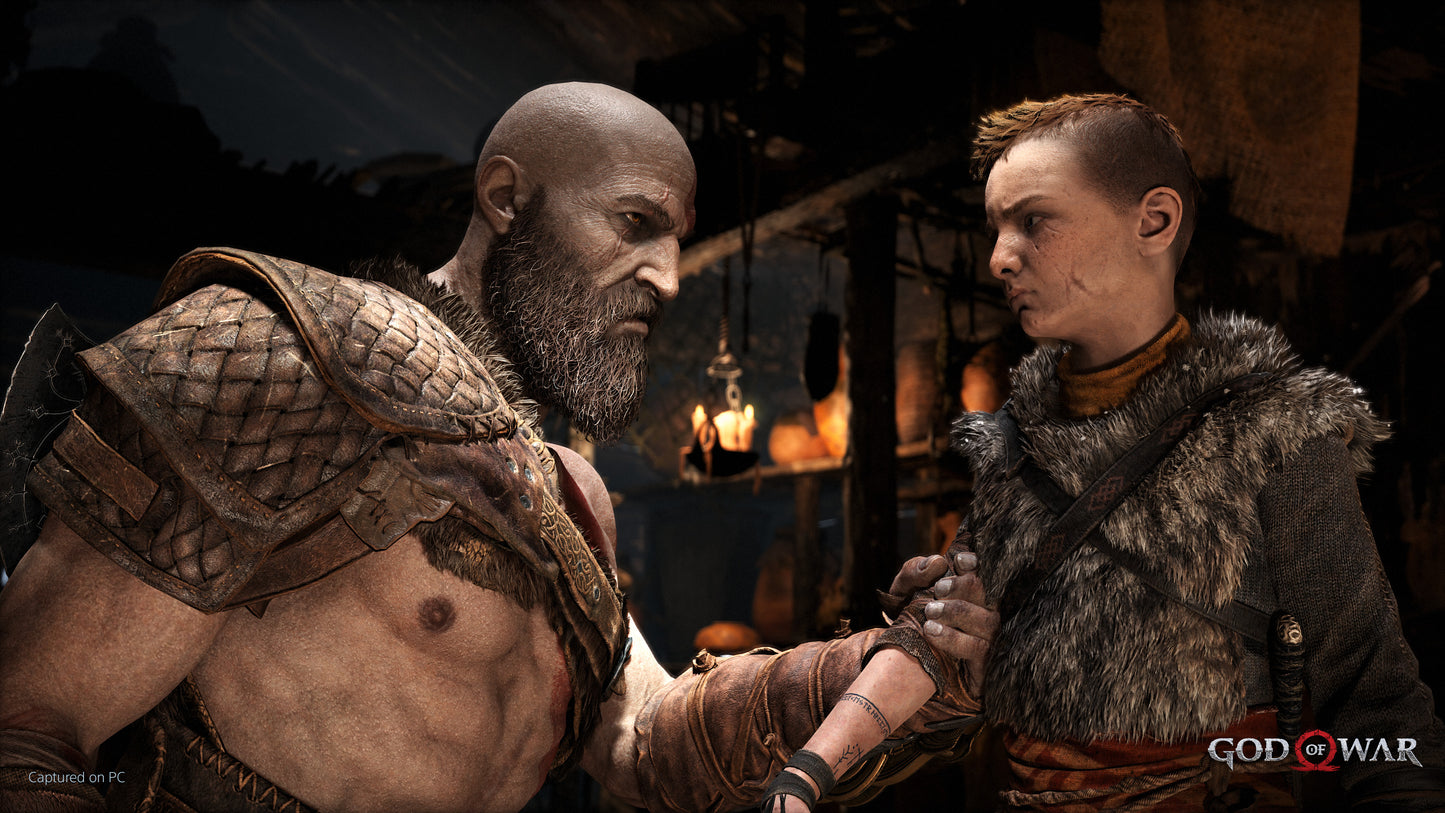 Two characters from 'God of War' in a close encounter with a dimly lit background.