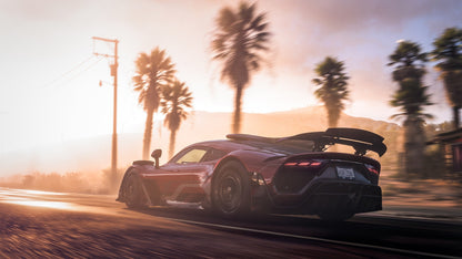 Supercar on a track with palm trees and sunset in the background