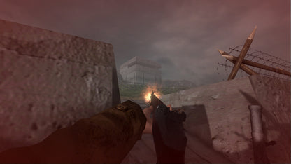 First-person shooter game scene with a gun aimed at a wall in a snowy landscape.