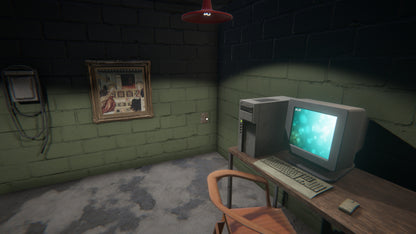 Vintage computer setup in a dimly lit room with a framed picture on the wall.