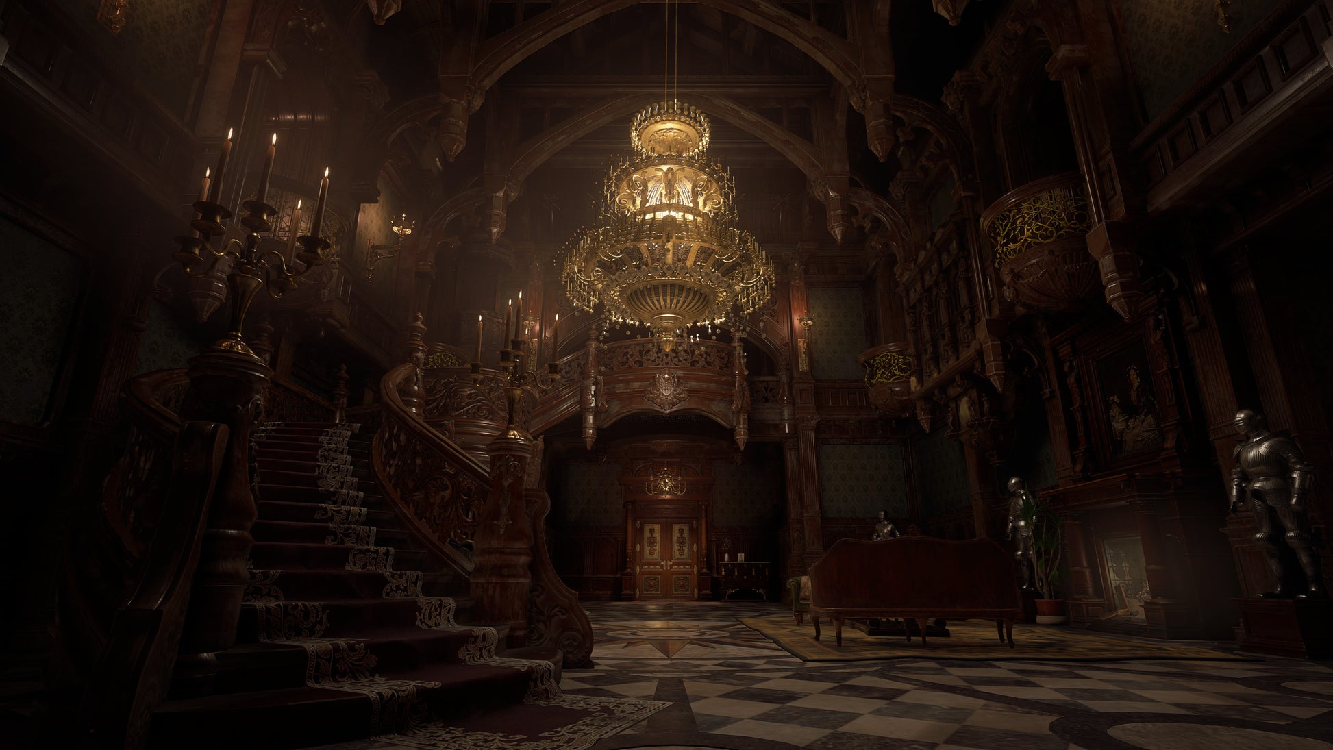 Elaborate interior of a grand building with ornate staircase and chandelier.
