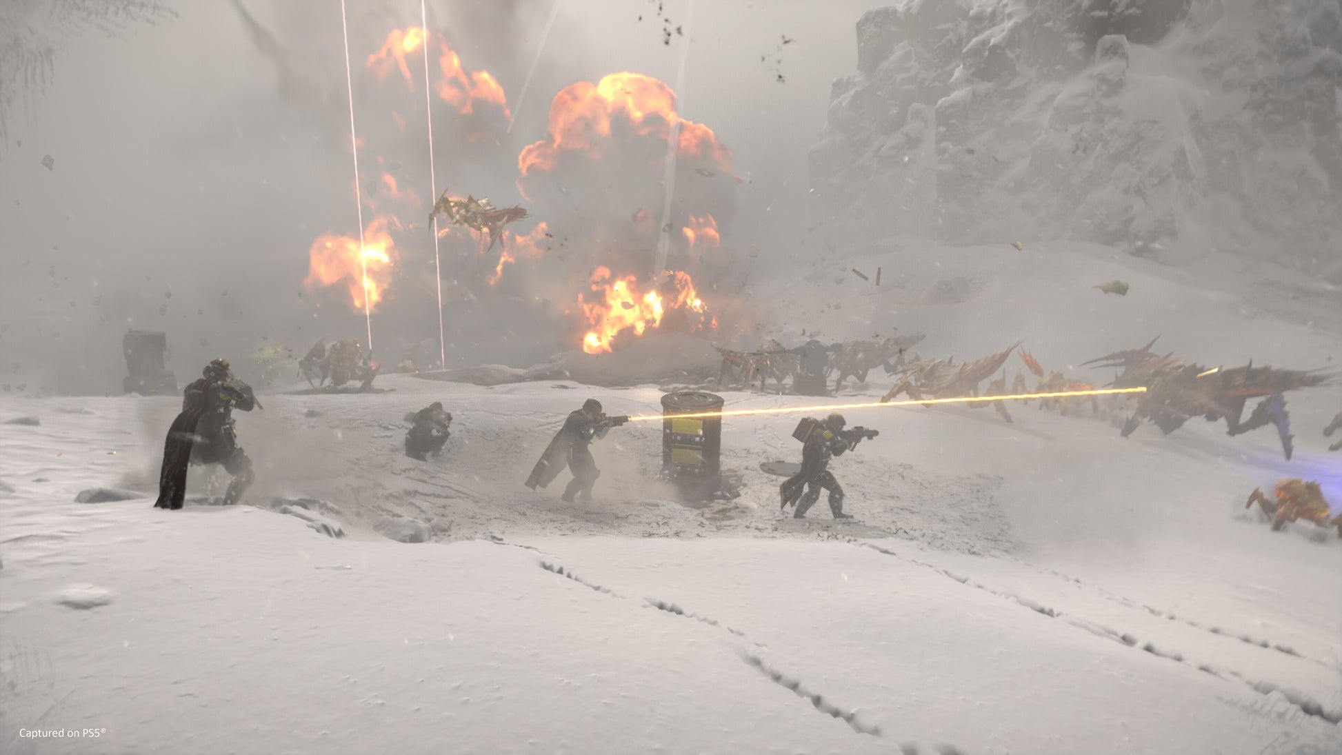 Action scene with characters in a snowy landscape with explosions and fire.