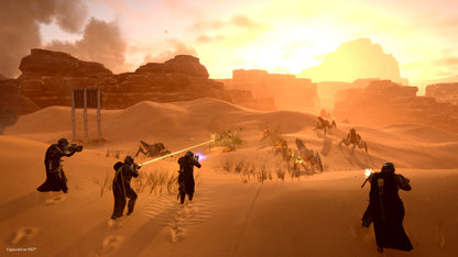 Desert landscape with characters in a sci-fi setting, likely from a video game or movie.