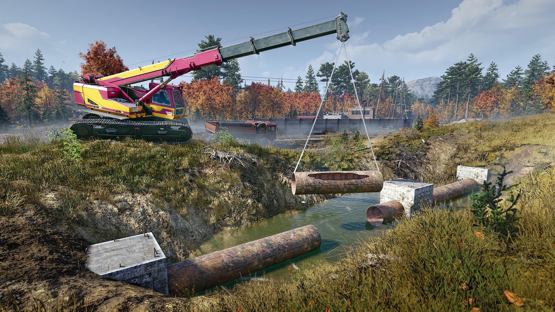 Excavator in a forested area with pipes and equipment on a clear day.