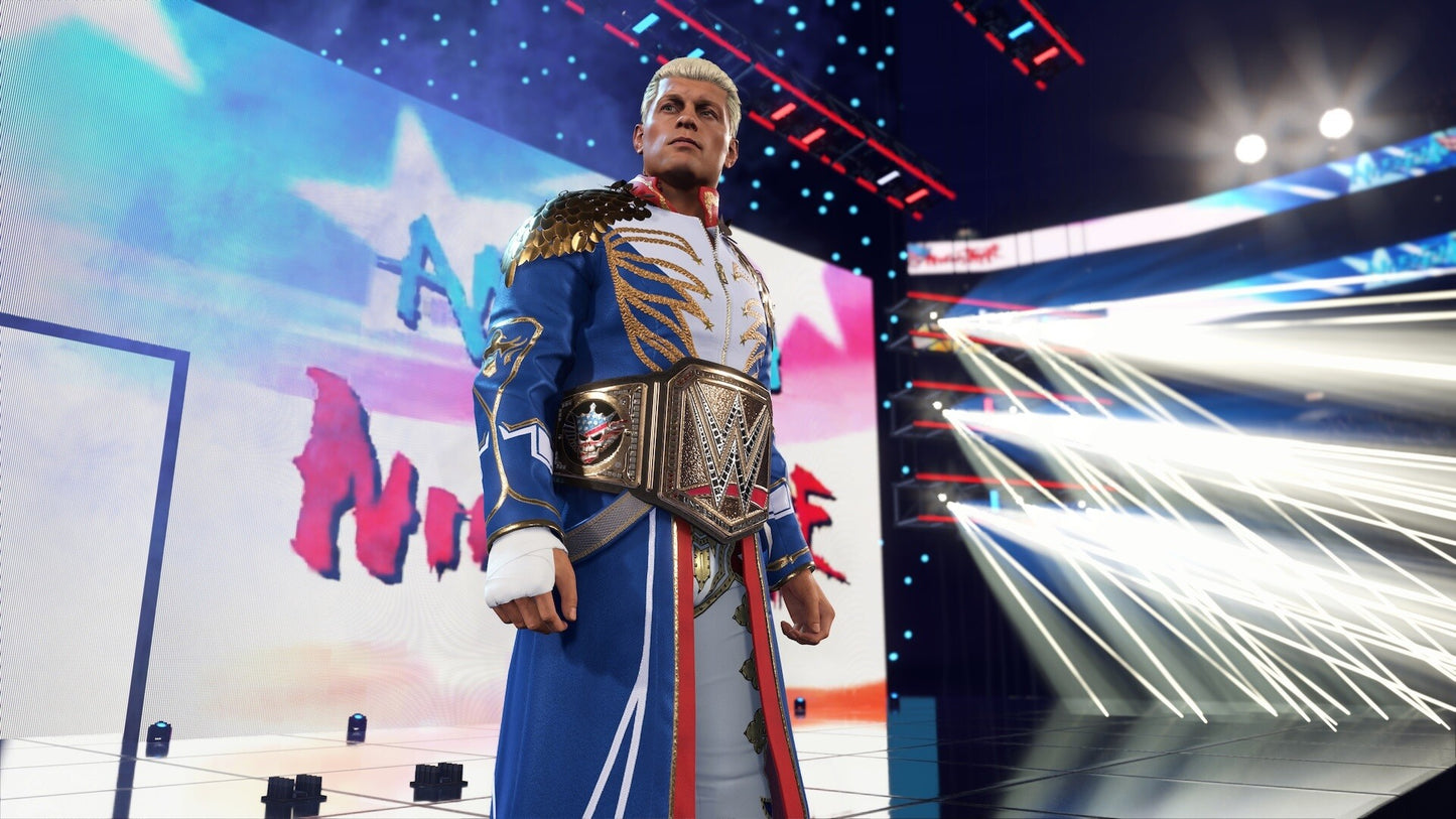 Person in a blue and gold wrestling outfit with a championship belt on a colorful stage.