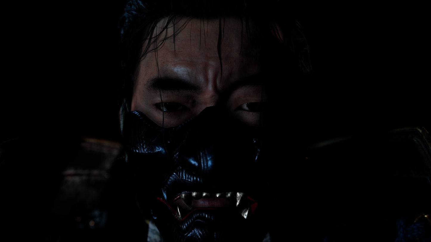 Person wearing a dark mask with intricate patterns in a dimly lit setting