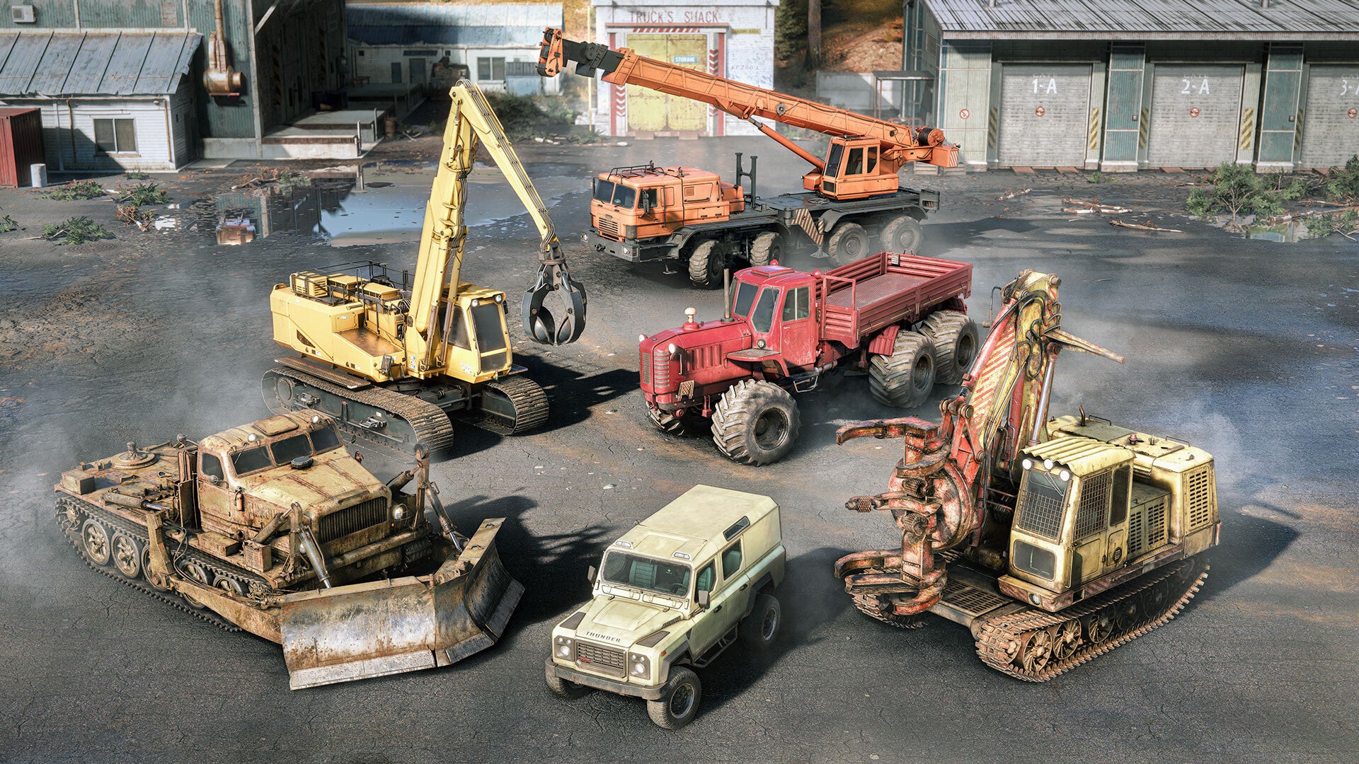 Collection of old and worn construction vehicles on a concrete surface.