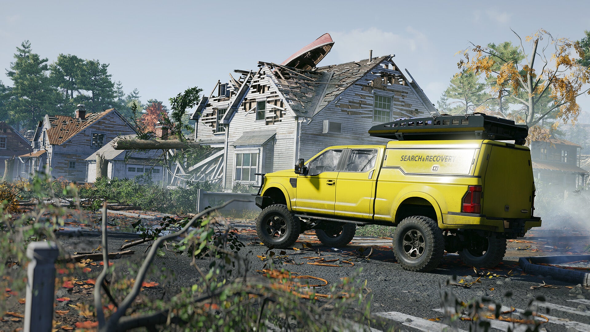 Yellow truck with 'SEARCH & RESCUE' on a destroyed street