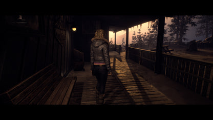 Person walking on a wooden porch during sunset or sunrise