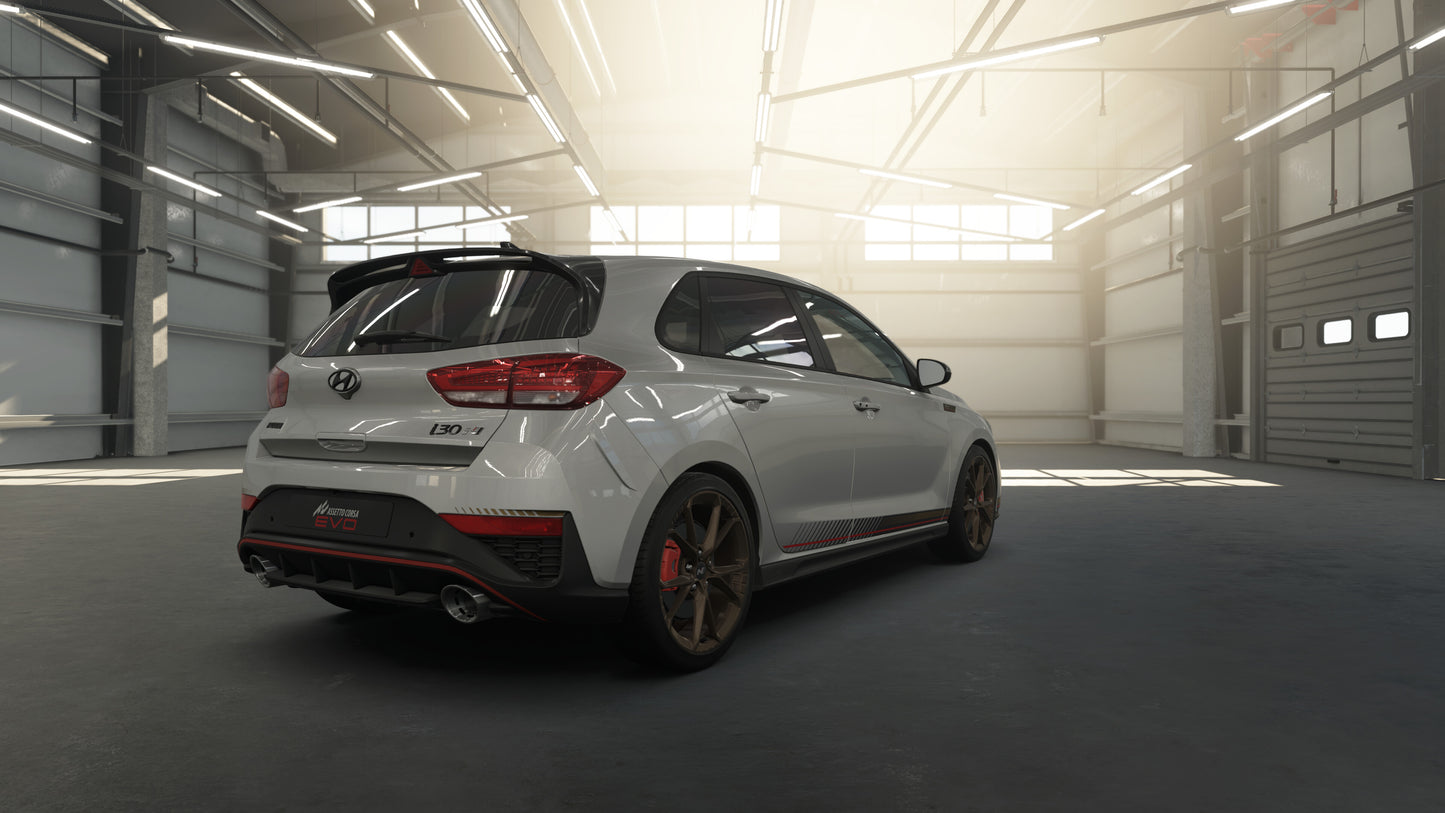 White Hyundai car in a large industrial garage with sunlight streaming in.