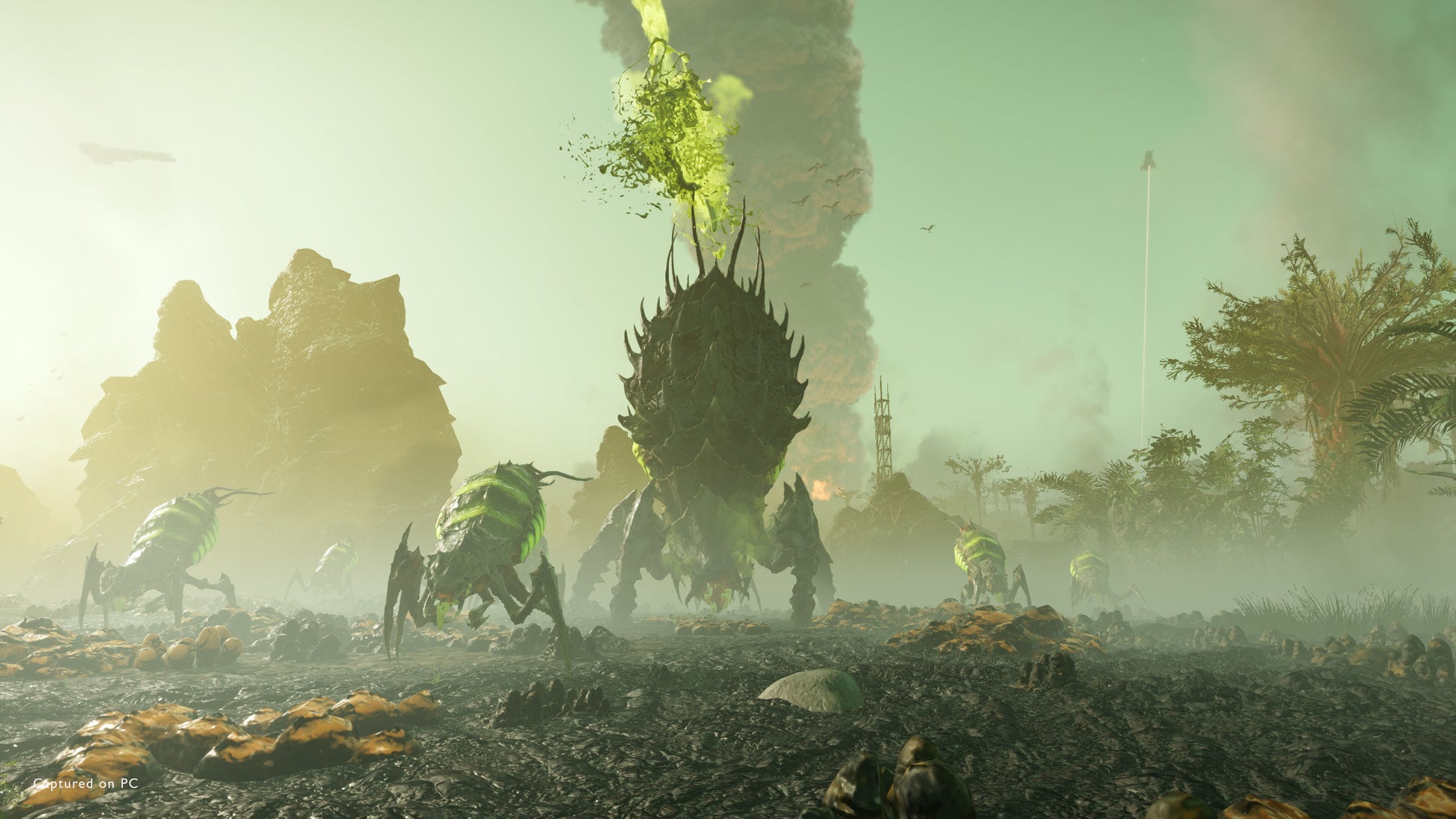 Fantasy scene with large creatures and a tower in a misty landscape