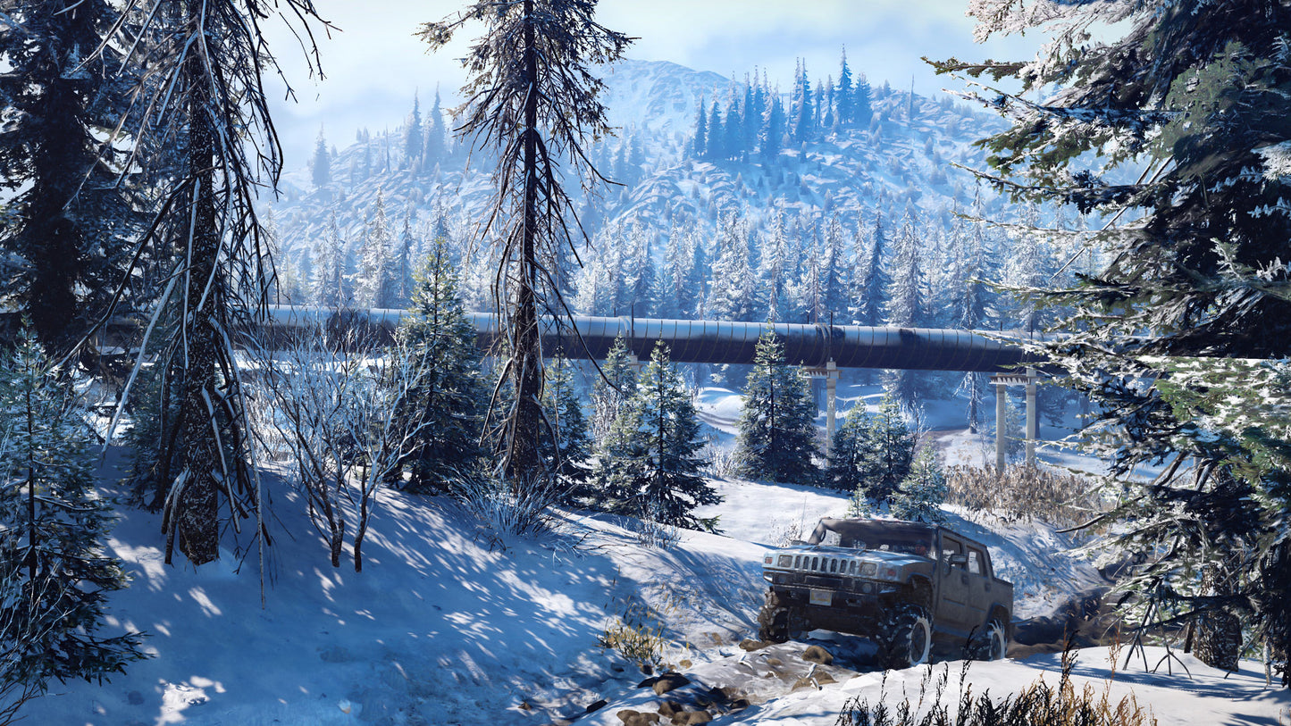 Jeep in a snowy forest with a mountain in the background