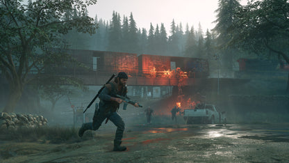 Person holding a weapon in a foggy, post-apocalyptic setting with a building on fire in the background.