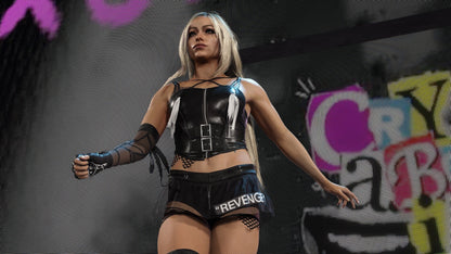 Person in a black outfit with 'Revenge' on shorts, standing against a colorful graffiti background.
