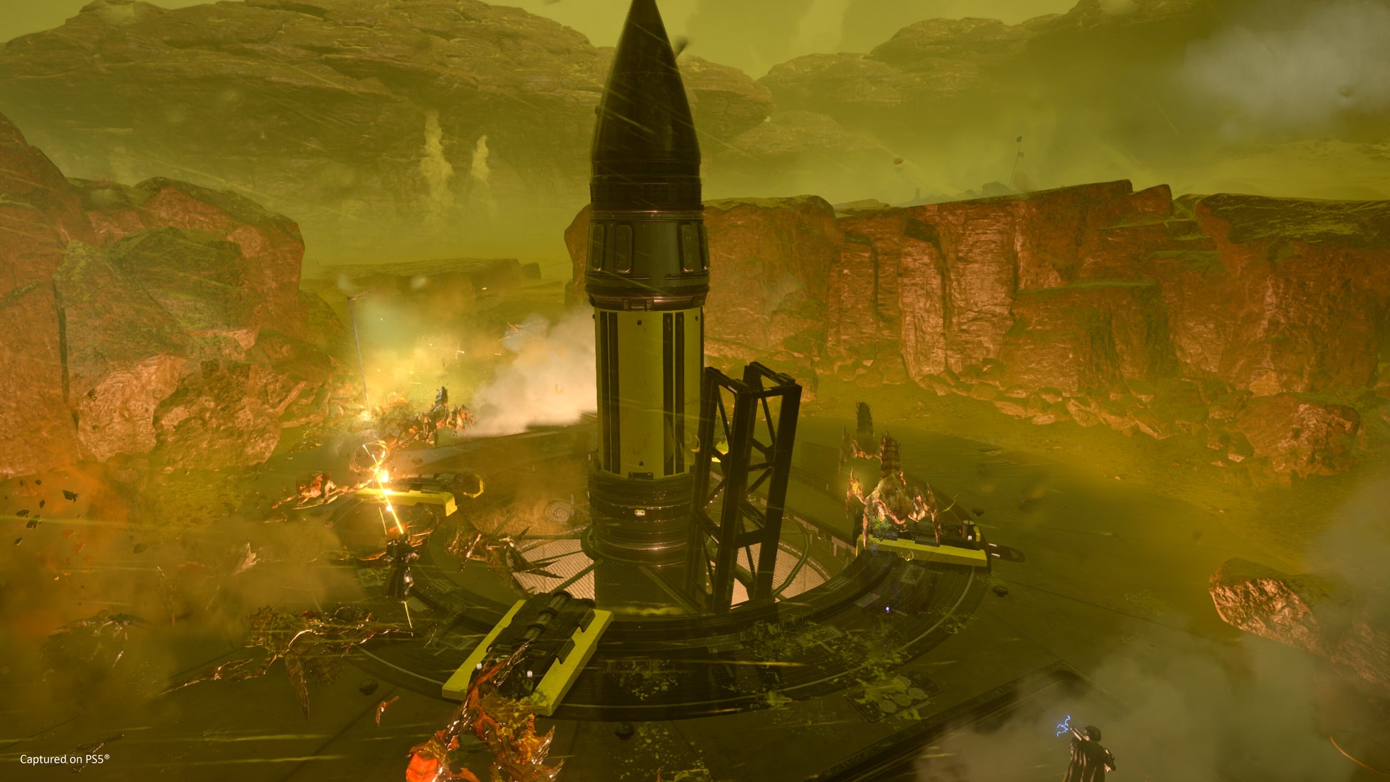 Rocket launch pad in a desert landscape with mountains in the background