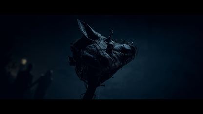 Dark, shadowy figure with a horse head silhouette against a dark background
