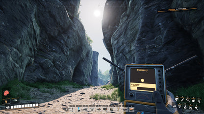 Hand holding a radio device with rocky landscape in the background