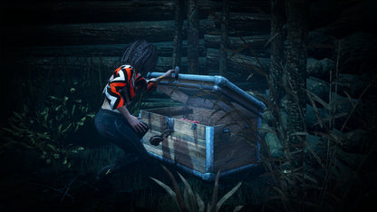 Person in a striped shirt interacting with a wooden crate in a dark, forest-like setting