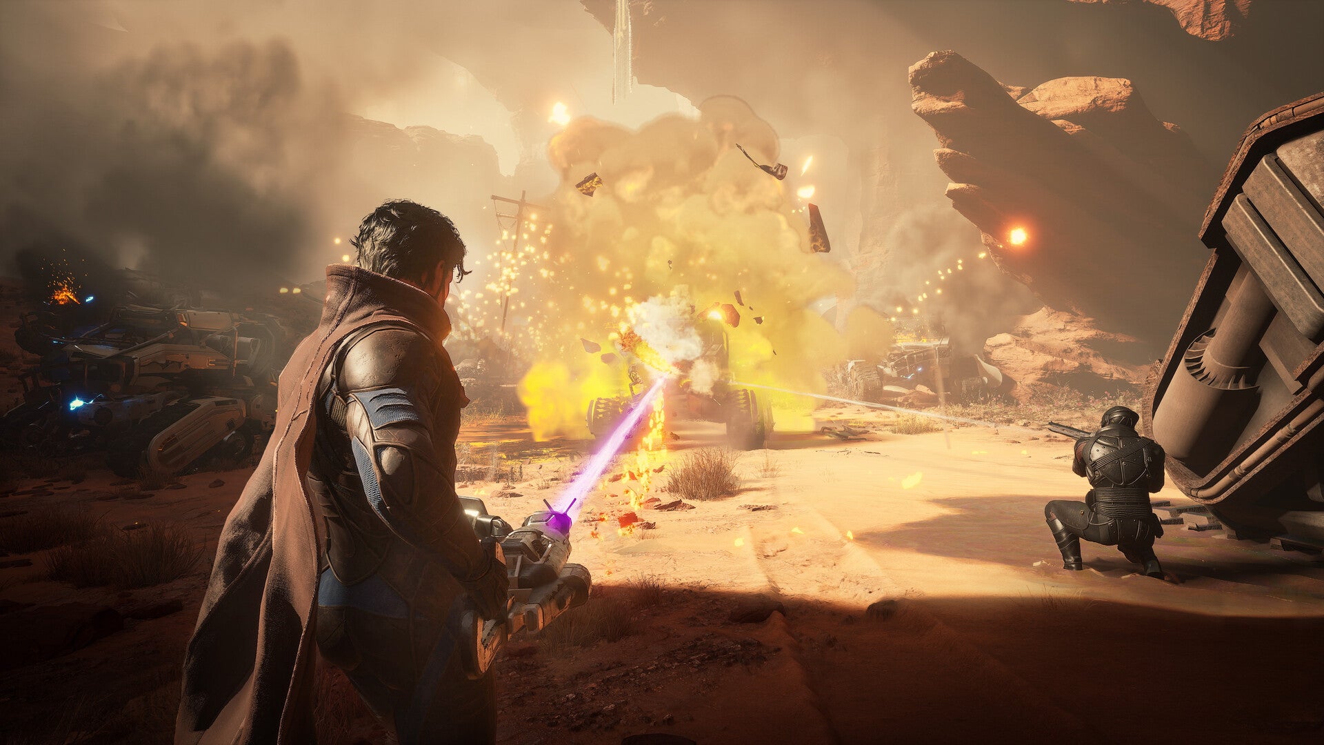 Character with a glowing weapon in a desert-like environment with explosions and vehicles.