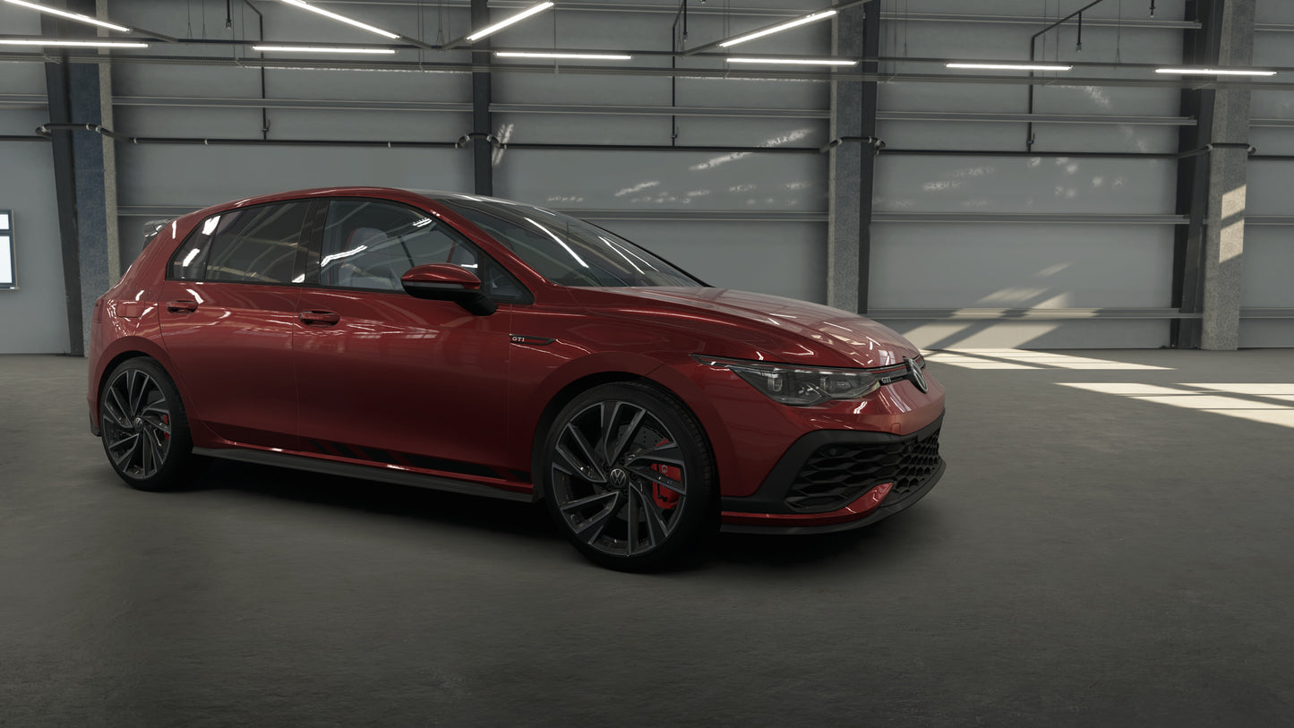 Red car parked inside a warehouse.
