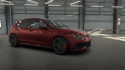 Red car parked inside a warehouse.