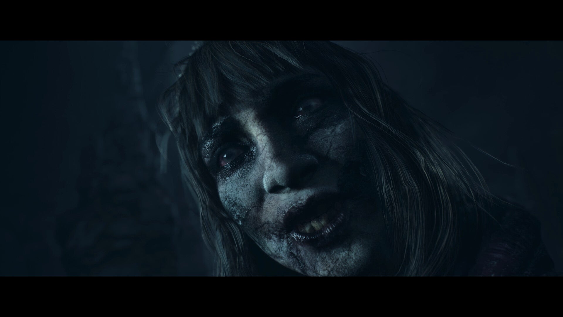 Close-up of a person with a dark, eerie atmosphere