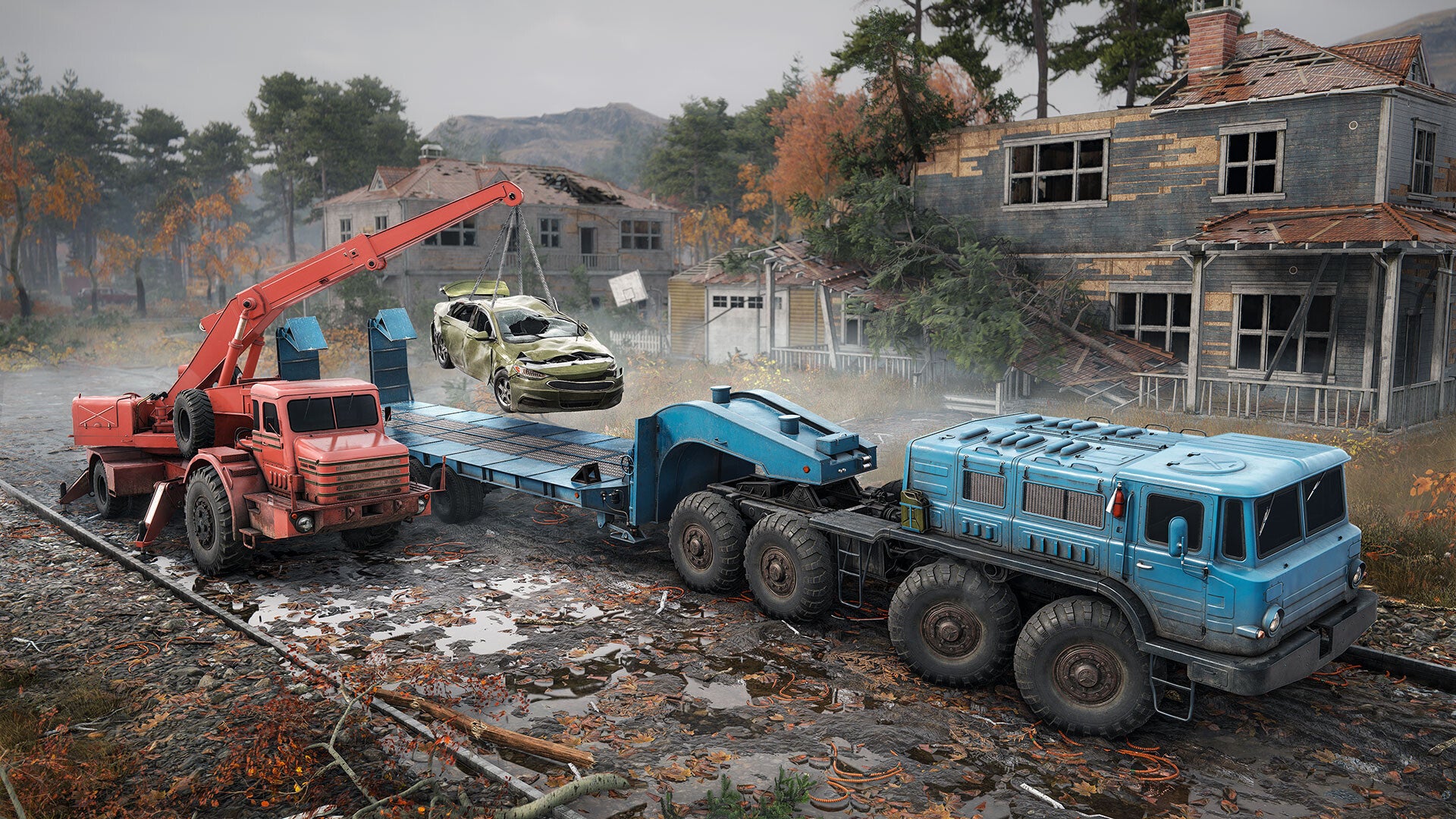 Scene with a large blue truck on a flatbed, a red crane, and a damaged building in the background.