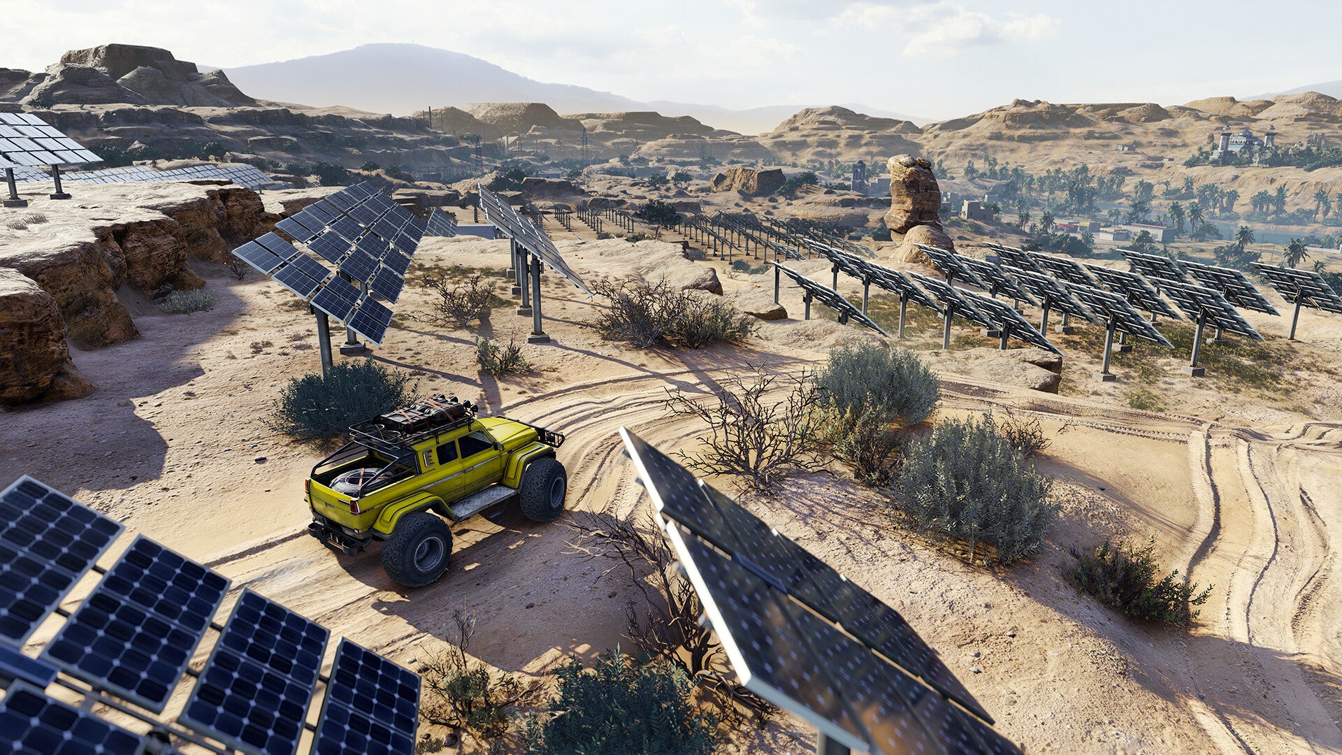 Yellow off-road vehicle in a desert landscape with solar panels and ruins.